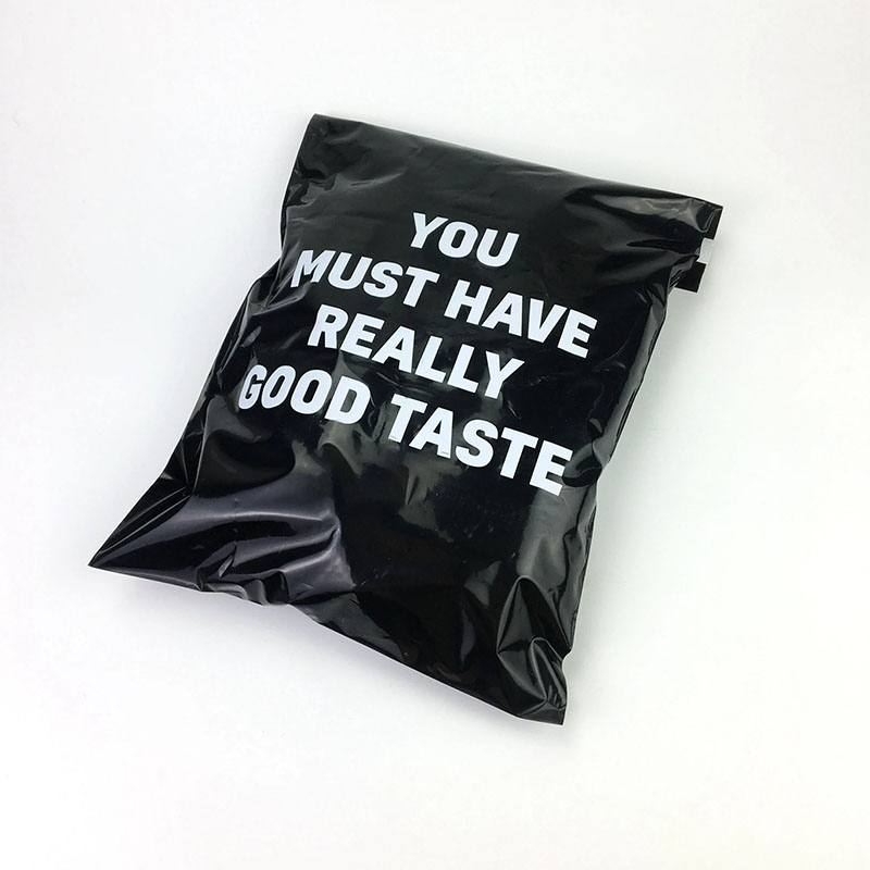 Black poly mailer printed with a large white message across the front panel