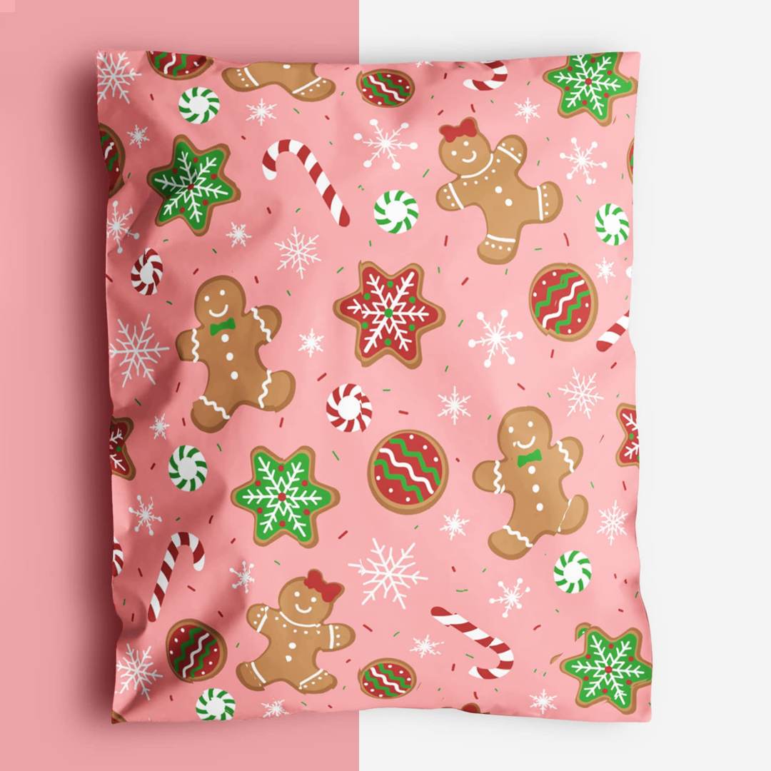 Pink mailer printed with gingerbread figures, candy canes and snowflakes