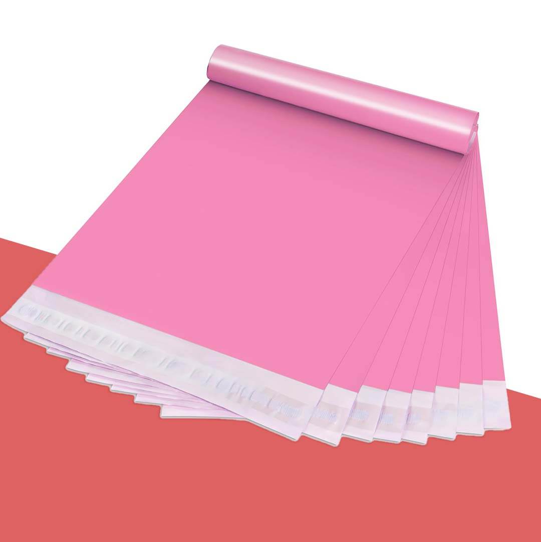 Rolled stack of bright pink poly mailers with self-adhesive seal strips