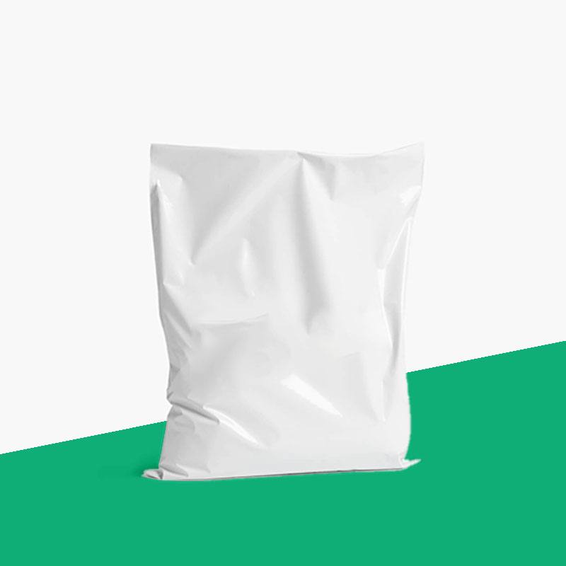 Plain white poly mailer standing upright and packed, with no printing on the panel