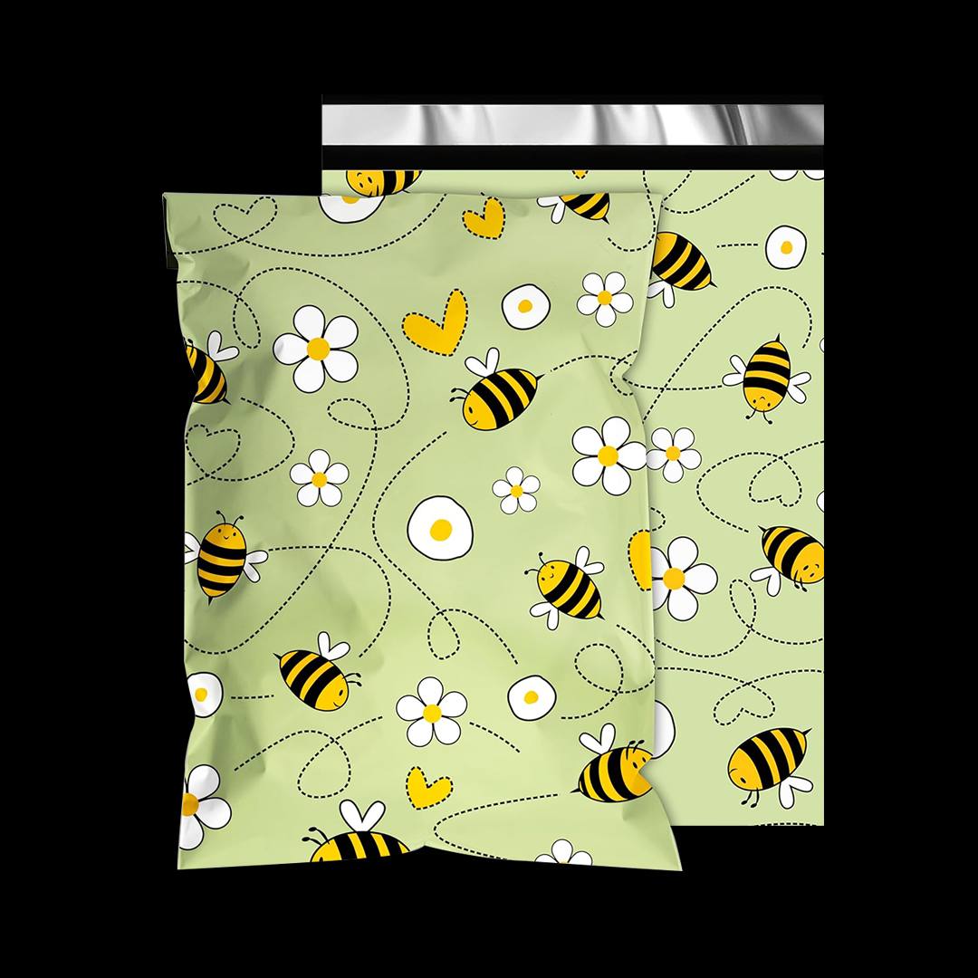 Sage green mailer printed with a repeating pattern of bees, daisies and dotted flight lines