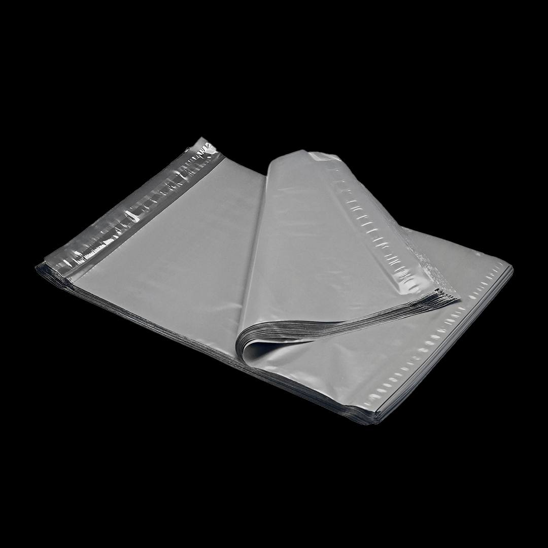 Large silver-grey mailers stacked flat, illustrating how big formats store before use