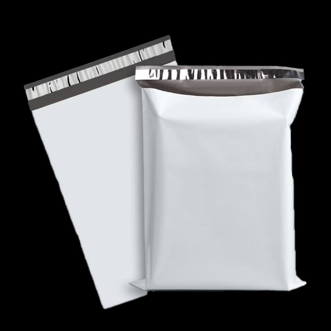 Unprinted mailer packed alongside a flat one, showing plain stock in use