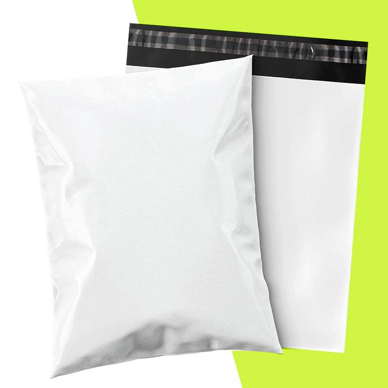 White poly mailer shown filled beside a flat empty mailer with a dark seal strip